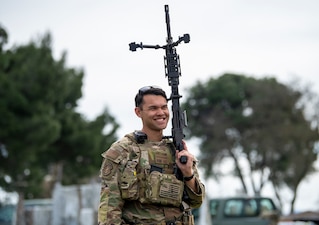 Man stands with weapon