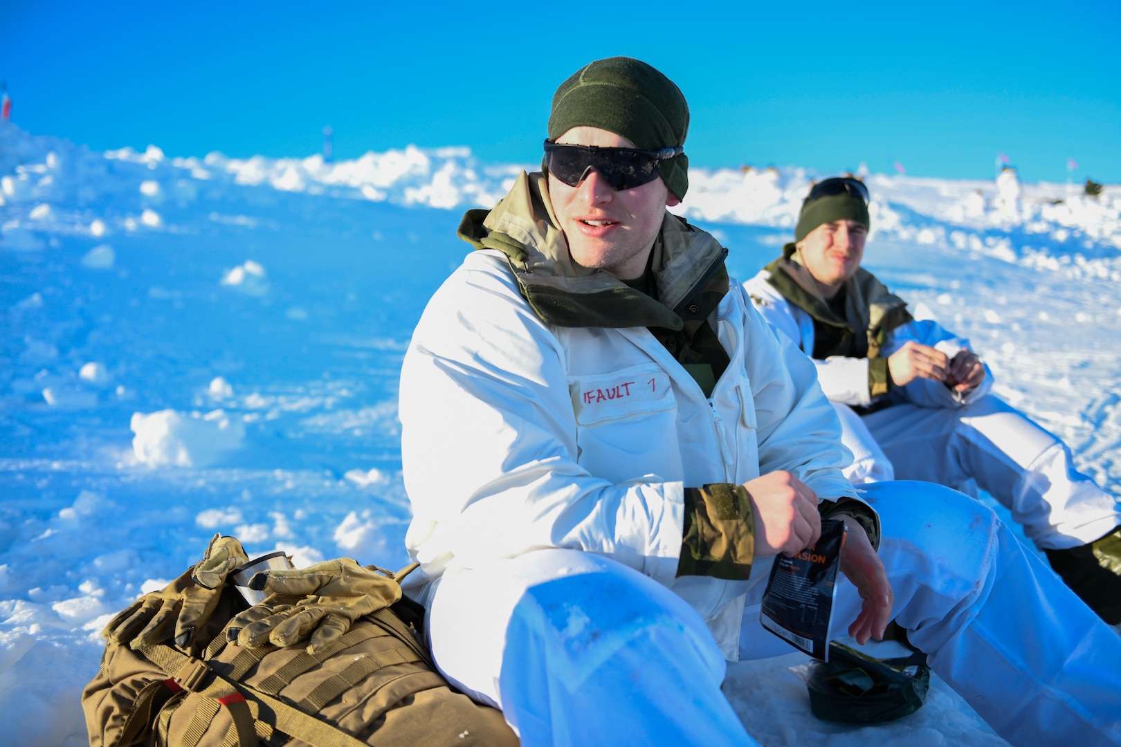 U.S. Army 1st Lt. Trevor Dufault of the Minnesota National Guard takes a break during a field training exercise on a mountaintop near Haltdalen, Norway, Feb. 11, 2025. During the exercise, service members built snow caves where they slept at night.