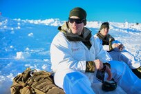U.S. Army 1st Lt. Trevor Dufault of the Minnesota National Guard takes a break during a field training exercise on a mountaintop near Haltdalen, Norway, Feb. 11, 2025. During the exercise, service members built snow caves where they slept at night.