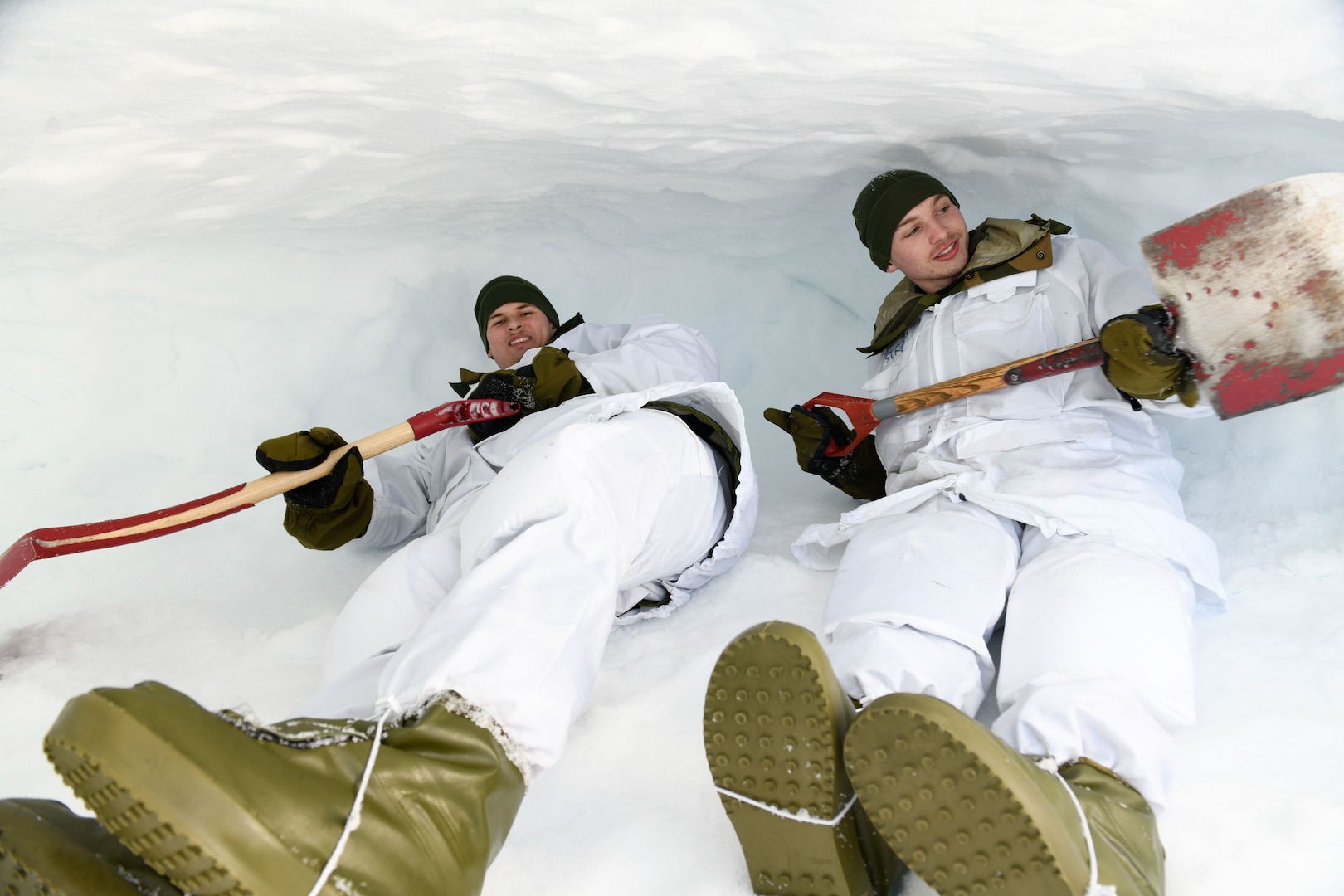 Minnesota National Guardsmen shovel out snow caves to sleep in on a mountaintop near Haltdalen, Norway, Feb. 11, 2025. The Guard members were part of NOREX, the Reciprocal Norwegian Exchange, whereby 100 Minnesota National Guardsmen and 100 Norwegian Home Guardsmen visit the opposite country to train and exchange cultural understandings.