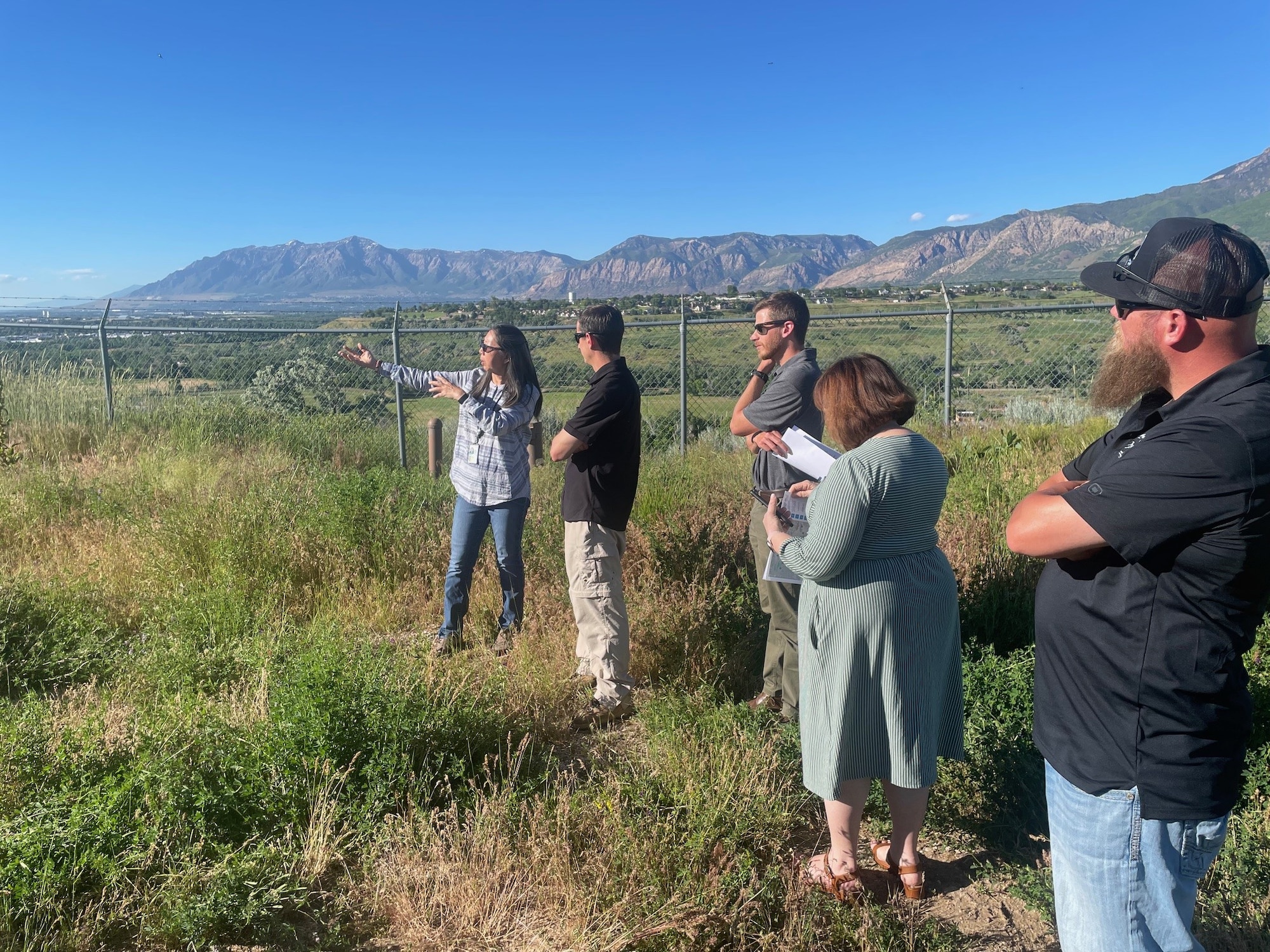 Peifen Tamashiro, remedial project manager, gives a base tour to members of Hill's Restoration Advisory Board.  The board was formed to enhance community participation in the cleanup process and provide a forum for meaningful dialogue between community members, stakeholders, and Hill AFB environmental officials. (Courtesy photo)