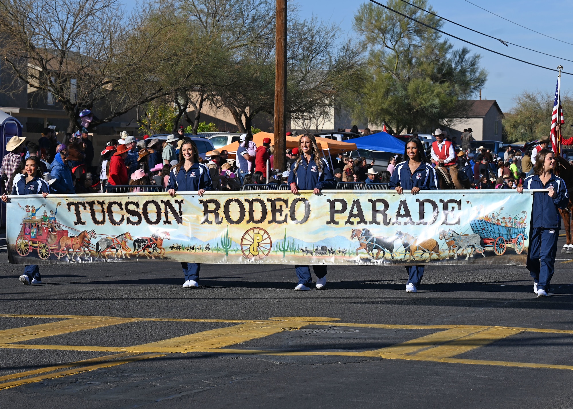 The 100th Annual Tucson Rodeo Parade kicks off in Tucson, Arizona, Feb. 20, 2025. Members assigned to the 355th Wing participated in the parade to show community support. (U.S. Air Force photo by Staff Sgt. Abbey Rieves)