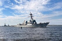 The Arleigh-Burke class guided missile destroyer USS Thomas Hudner (DDG 116) gets underway from Naval Station Mayport