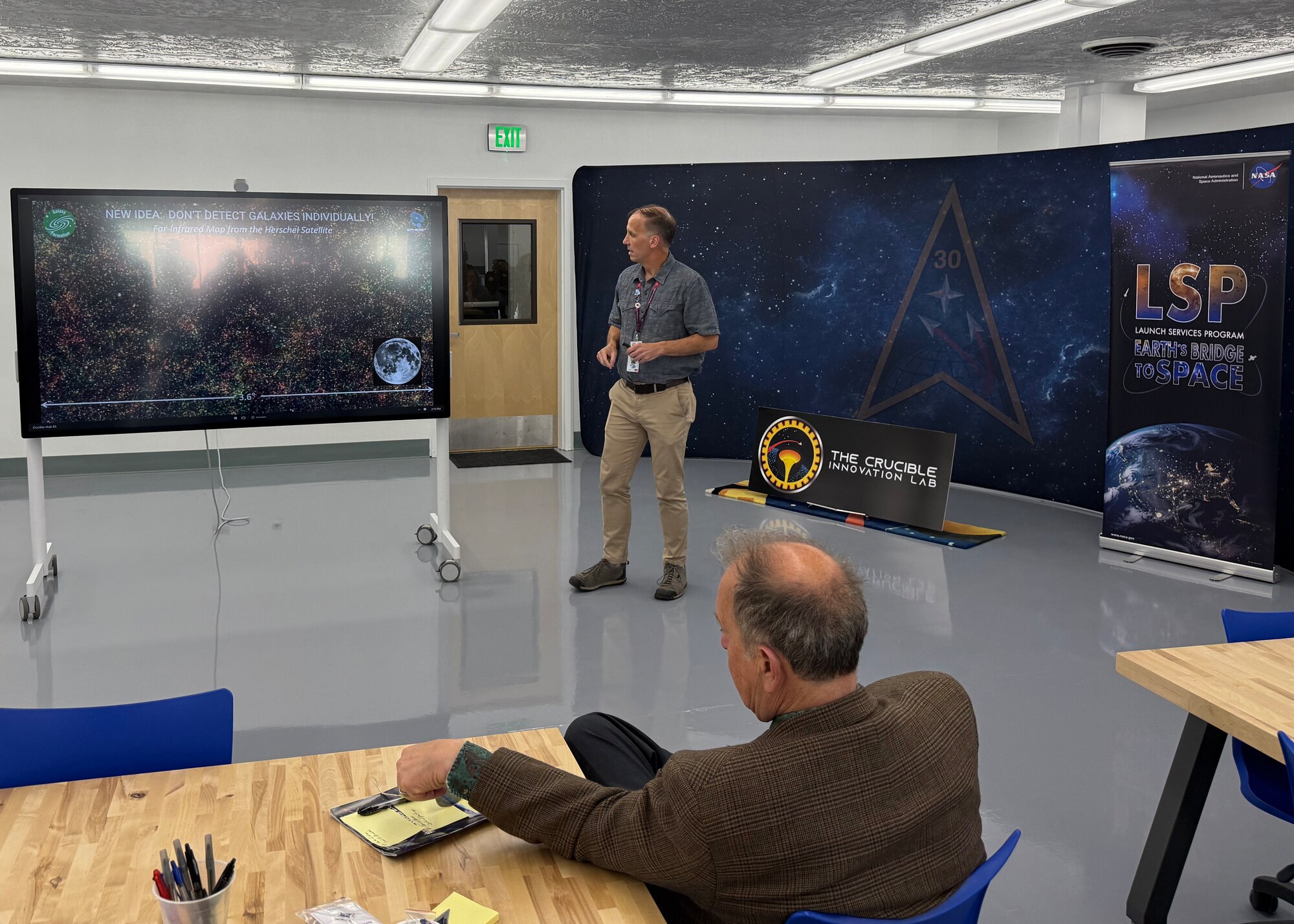 presenters talking about nasa's spherex mission coming up where they are going on a two year mission, audience listening