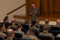 U.S. Marine Corps Col. Paul Bock, commanding officer of Combat Logistics Regiment 37, 3rd Marine Logistics Group (3rd MLG), speaks during a Korean Marine Exchange Program pre-deployment brief at Camp Kinser, Okinawa, Japan, Feb. 6, 2025. Marines and Sailors with 3rd MLG attended a pre-deployment brief designed to equip them with essential information on operational readiness, mental resilience, and support services to help them transition smoothly into their deployment. (U.S. Marine Corps photo by Lance Cpl. Rachel Mason)