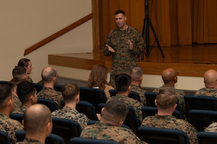 U.S. Marine Corps Col. Paul Bock, commanding officer of Combat Logistics Regiment 37, 3rd Marine Logistics Group (3rd MLG), speaks during a Korean Marine Exchange Program pre-deployment brief at Camp Kinser, Okinawa, Japan, Feb. 6, 2025. Marines and Sailors with 3rd MLG attended a pre-deployment brief designed to equip them with essential information on operational readiness, mental resilience, and support services to help them transition smoothly into their deployment. (U.S. Marine Corps photo by Lance Cpl. Rachel Mason)
