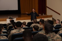 Ken Hirano, the Marine and Family Life counselor of 3rd Marine Logistics Group (3rd MLG), speaks during a Korean Marine Exchange Program pre-deployment brief at Camp Kinser, Okinawa, Japan, Feb. 6, 2025. Marines and Sailors with 3rd MLG attended a pre-deployment brief designed to equip them with essential information on operational readiness, mental resilience, and support services to help them transition smoothly into their deployment. (U.S. Marine Corps photo by Lance Cpl. Rachel Mason)