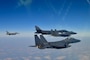 A U.S. Air Force F-16, left, flies in formation with a U.S. Air Force B-1B Lancer, middle, and two Republic of Korea Air Force F-15K Slam Eagles, during a bilateral training event in airspace over South Korea, Feb. 20, 2025.
