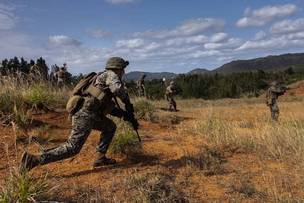 U.S. Marines buddy rush during a live-fire range on Camp Hansen, Okinawa, Japan, Feb. 14, 2025.