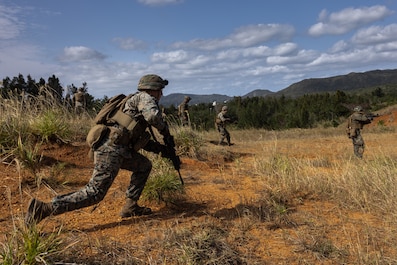 CAMP HANSEN, OKINAWA, Japan (Feb. 14, 2025) — U.S. Marines buddy rush during a live-fire range on Camp Hansen, Okinawa, Japan, Feb. 14, 2025. The four-day field exercise focused on marksmanship skills and fire team fire and movement, strengthening the unit’s combat capabilities. Live-fire ranges give Marines the opportunity to engage and destroy targets in a dynamic environment, enhancing battlefield effectiveness. The Marines are with 12th Marine Littoral Regiment, 3d Marine Division. (U.S Marine Corps photo by Lance Cpl. Rodney Frye)
