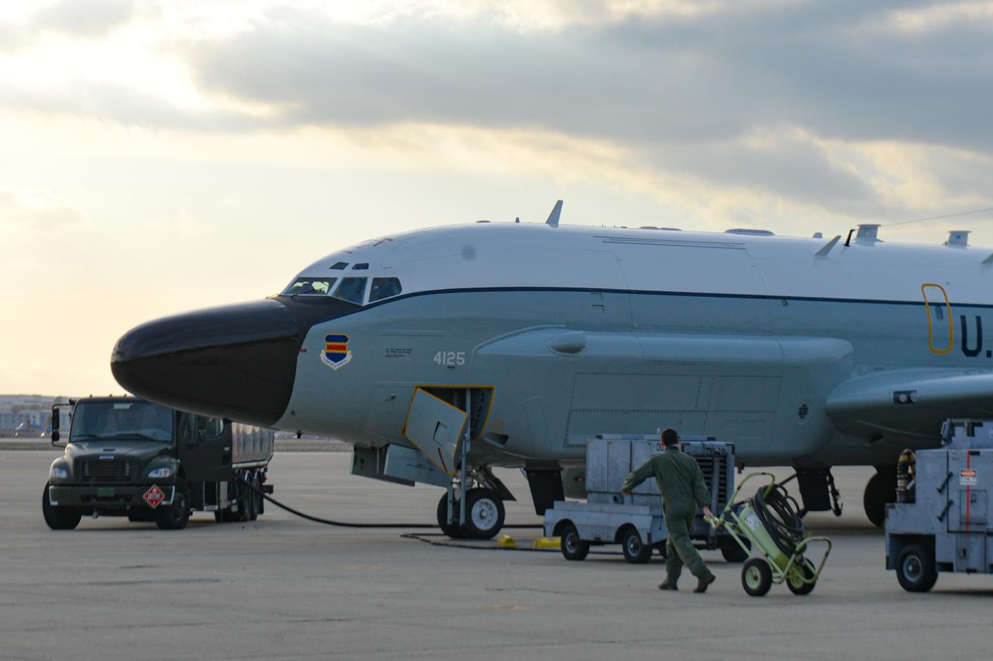 An RC-135V/W Rivet Joint aircrew from 343rd Reconnaissance Squadron, 97th Intelligence Squadron, 49th  IS, and the Royal Air Force 51st Squadron refuel at March Air Force Base during Bamboo Eagle 11, 2025. Members of the regular aircrew serviced the aircraft's fuel and other systems to ensure it was capable of executing it tasked mission safely to test and demonstrate the unique capability to have aircrew fill non-standard roles that further enable resilient and flexible logistics in support of agile combat employment to increase force survivability. (U.S. Air Force photo by Capt. Patrick Butler)