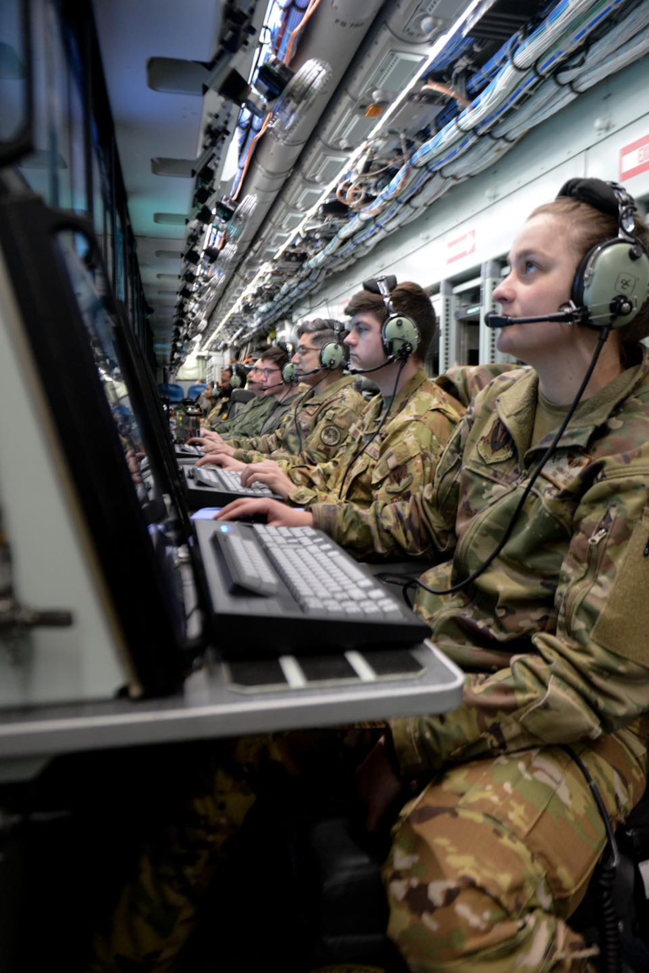 Airmen from the 343rd Reconnaissance Squadron and 97th Intelligence Squadron integrate with the Royal Air Force’s 51st Squadron on a RC-135V/W Rivet Joint before Red Flag 25-1 at Nellis Air Force Base, Nevada Jan. 26, 2025. Red Flag provides participants the opportunity to plan and employ together in a contested, degraded and operationally limited environment to strengthen integration among partners to maximize strategic capabilities. (U.S. Air Force photo by Capt. Patrick Butler)