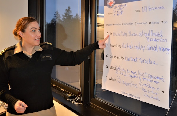 Pointing the way… Lt. Cmdr. Maggy Mitzkewich, NMRTC Bremerton Specialty Care department, shares with her colleagues during a TriService Nursing Research Program Evidence Based Practice training class. The training class, in conjunction with the Uniformed Services University, was held to refine attendees’ knowledge on the value of evidence based practice designed to help military nurses care for warfighters on the field of battle as well as retirees and dependents at a military treatment facility (Official Navy photo by Douglas H Stutz, NHB/NMRTC Bremerton public affairs officer).