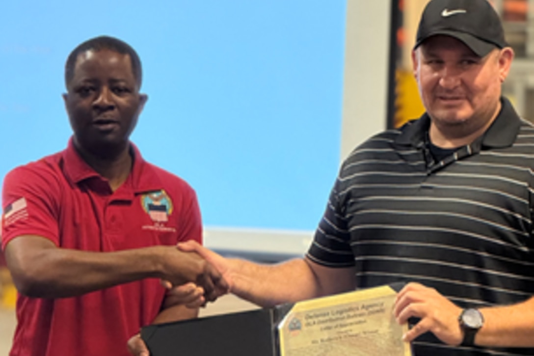 Employees participate in awards ceremony.