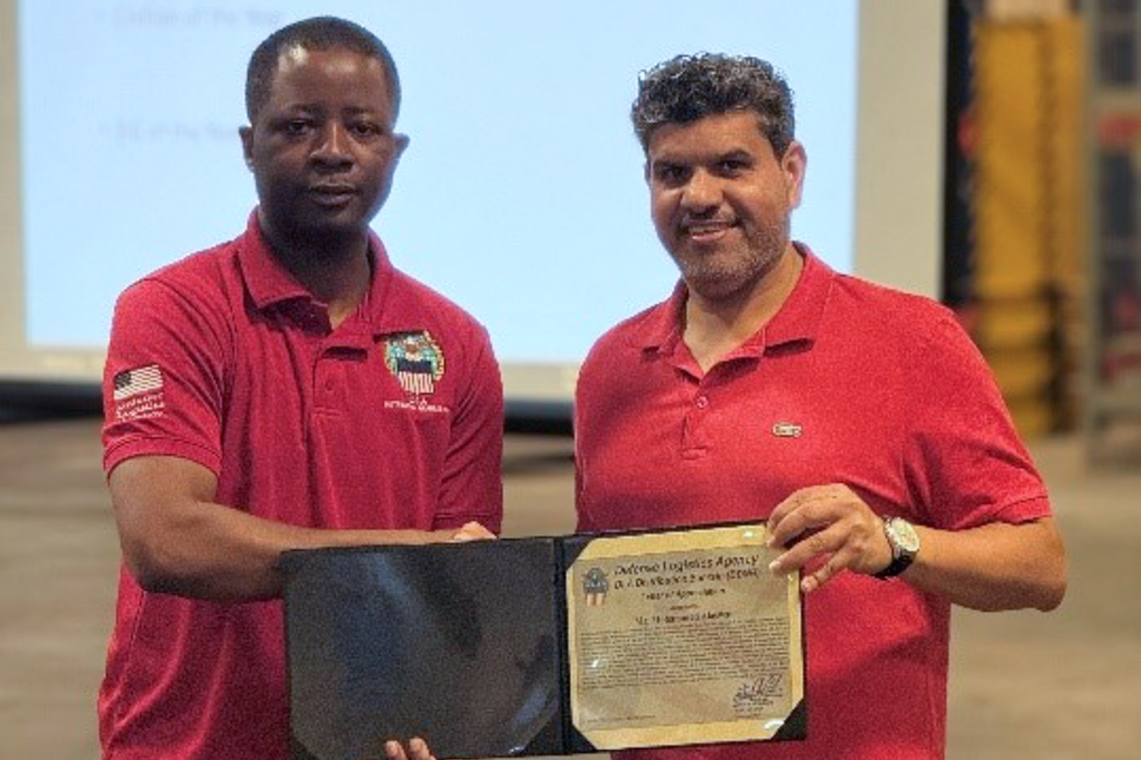 Employees participate in awards ceremony.