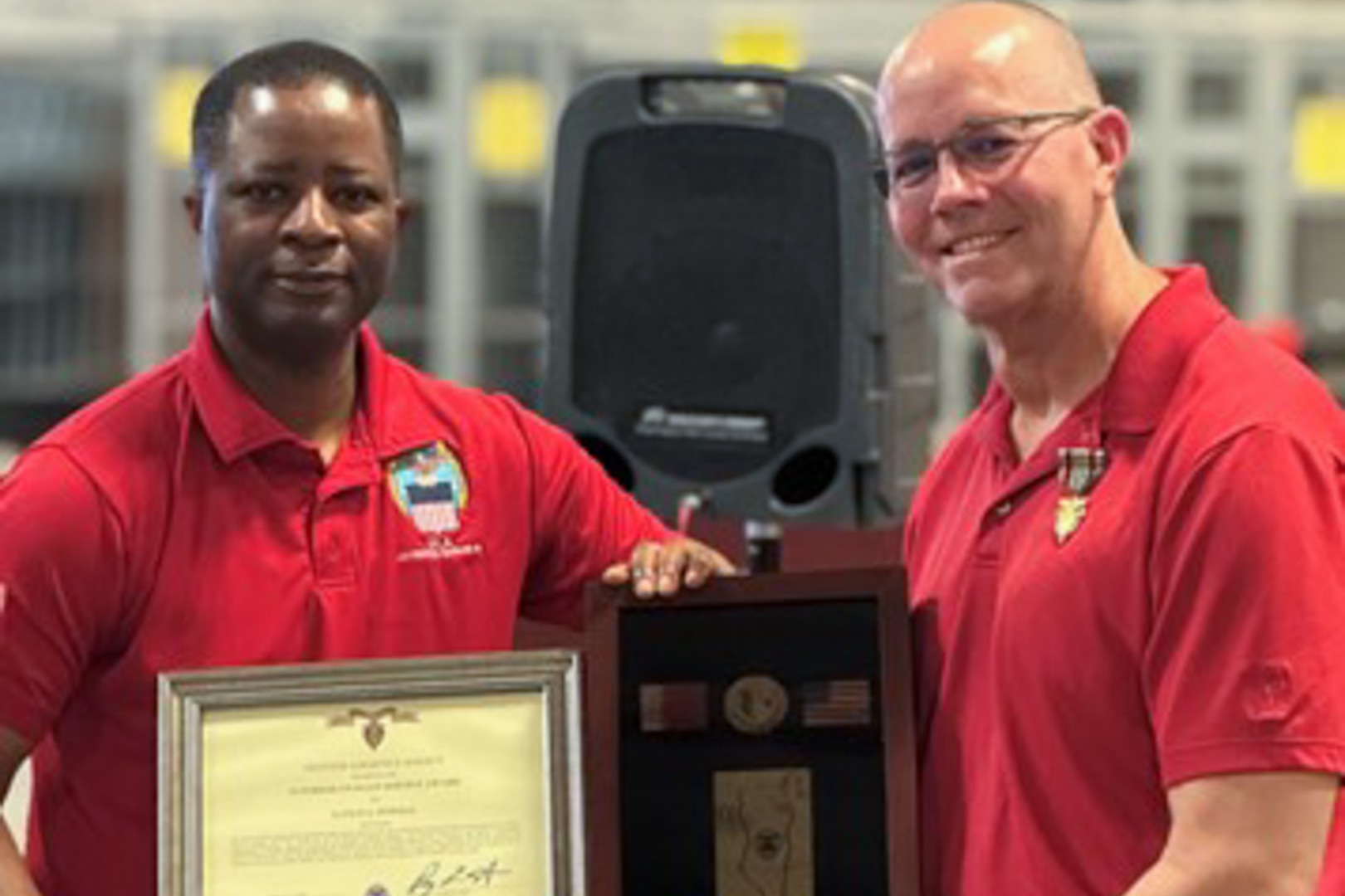 Employees participate in awards ceremony.