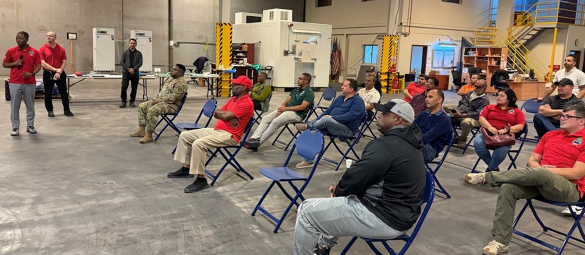 Employees participate in awards ceremony.