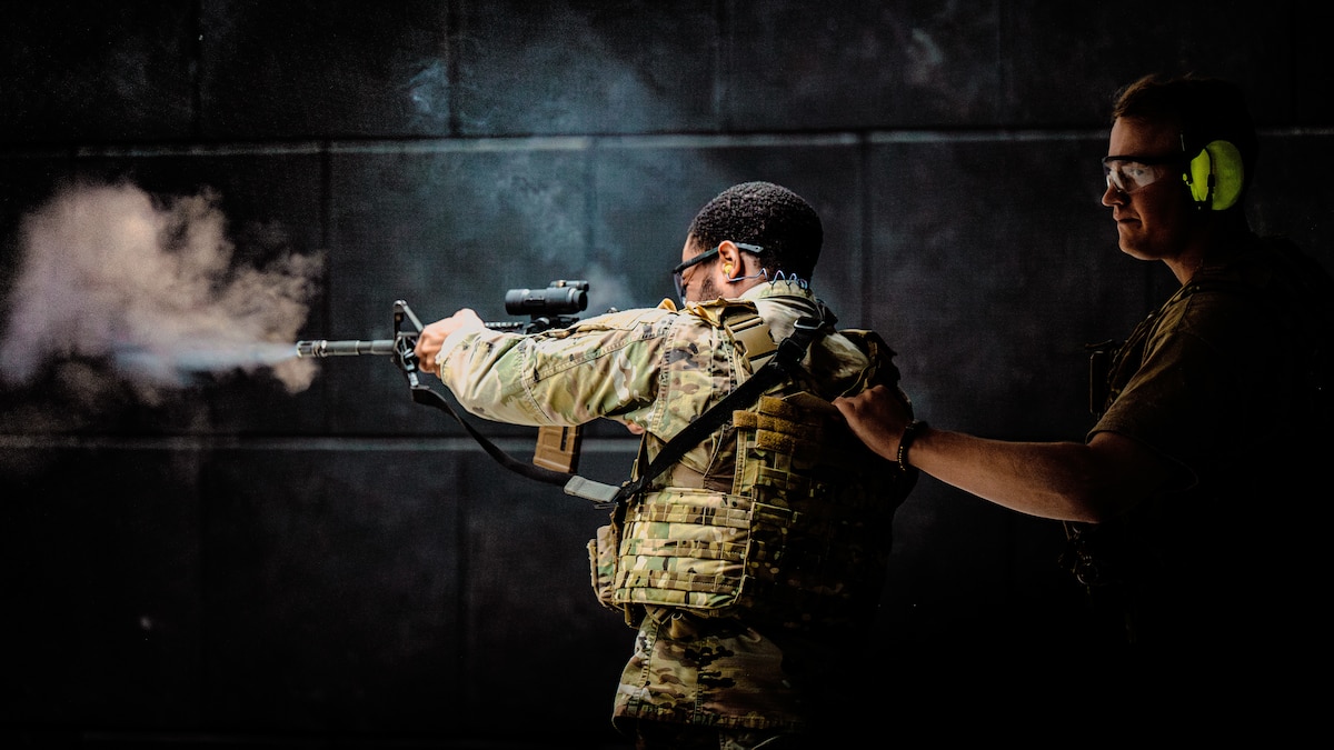 U.S. Air Force Staff Sgt. Derrius Amis, 379th Expeditionary Force Support Squadron services specialist, and Senior Airman Kameron Kensington, 379th Expeditionary Security Forces Squadron installation patrolman, perform an aft engagement drill during a tactical leadership course within the U.S. Central Command area of responsibility, Jan. 23, 2025. Utilizing the Mission-Ready Airman concept, students from various career fields received training with M4 carbines to build readiness for installation security scenarios. (U.S. Air Force photo by Airman 1st Class Zeeshan Naeem)