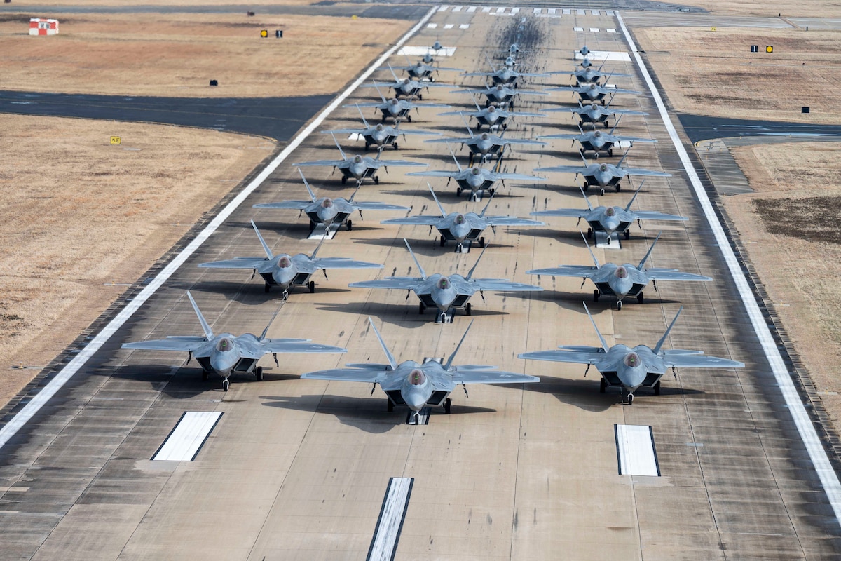 F-22 Raptors and T-38 Talons from the 1st Fighter Wing conduct an elephant walk at Joint Base Langley-Eustis, Va., Jan. 31, 2025. This demonstration highlighted the wing's capability to mobilize forces rapidly in high-stress scenarios. The 1st FW’s primary mission is to deliver dominant airpower, supporting global operations, rapid deployment and homeland defense. (U.S. Air Force photo by Tech Sgt. Matthew Coleman-Foster)