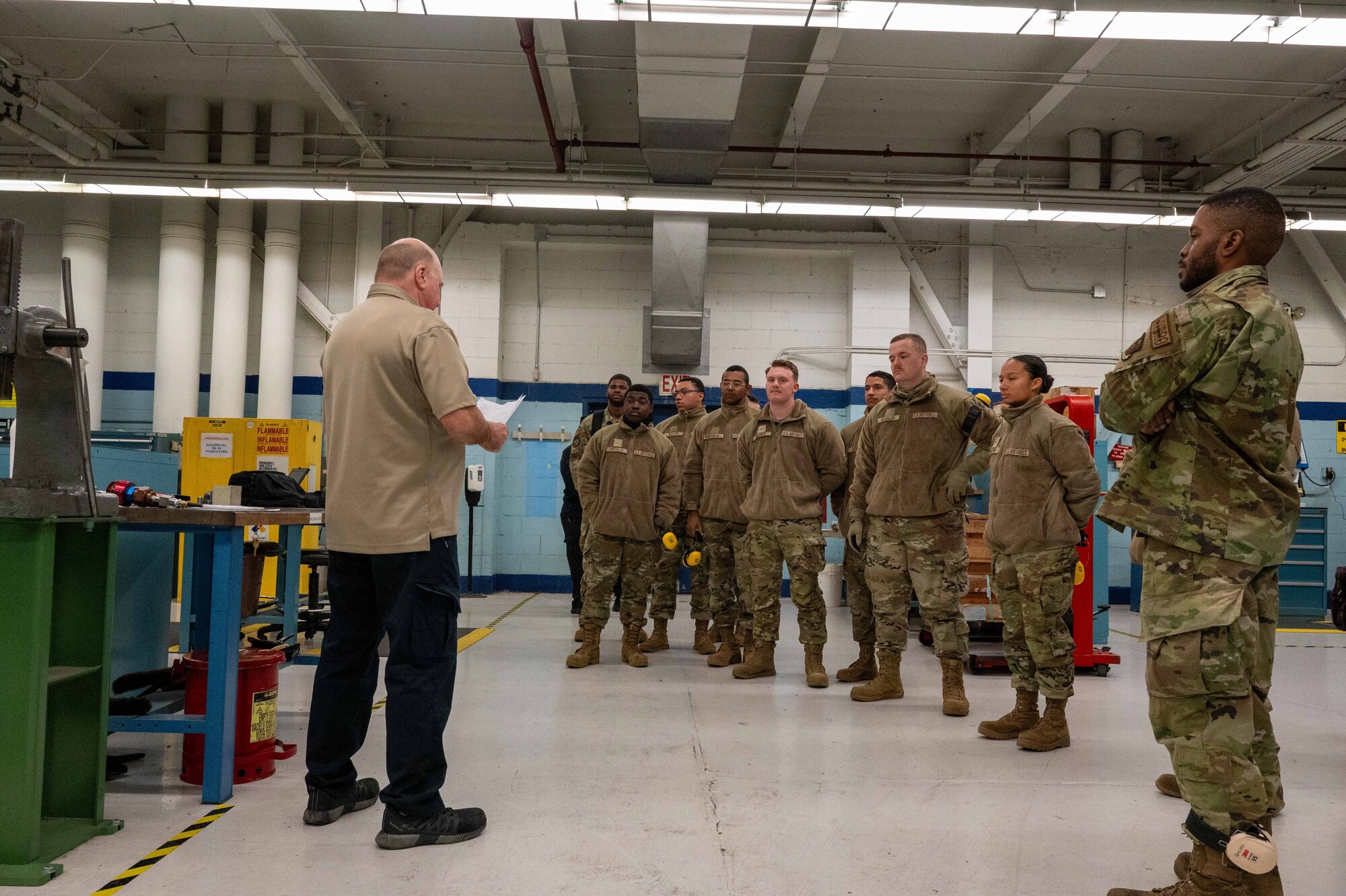 David Fojut, 97th Aircraft Maintenance Squadron aircraft pneudralics supervisor, gives a tour to students from the 364th Training Squadron aircraft hydraulics systems course at Altus Air Force Base (AFB), Oklahoma, Jan. 24, 2025. Ten students and their instructors were given a tour of the hydraulics shop and the three aircraft housed at Altus AFB. (U.S. Air Force photo by Senior Airman Kari Degraffenreed)