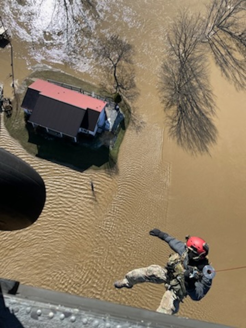 An Indiana National Guard Soldier conducts a hoist operation while searching for flood victims in eastern Kentucky Feb. 17, 2025. Indiana Gov. Mike Braun activated four Hoosier Guard members to help with search and rescue efforts in Kentucky following record-breaking floods.