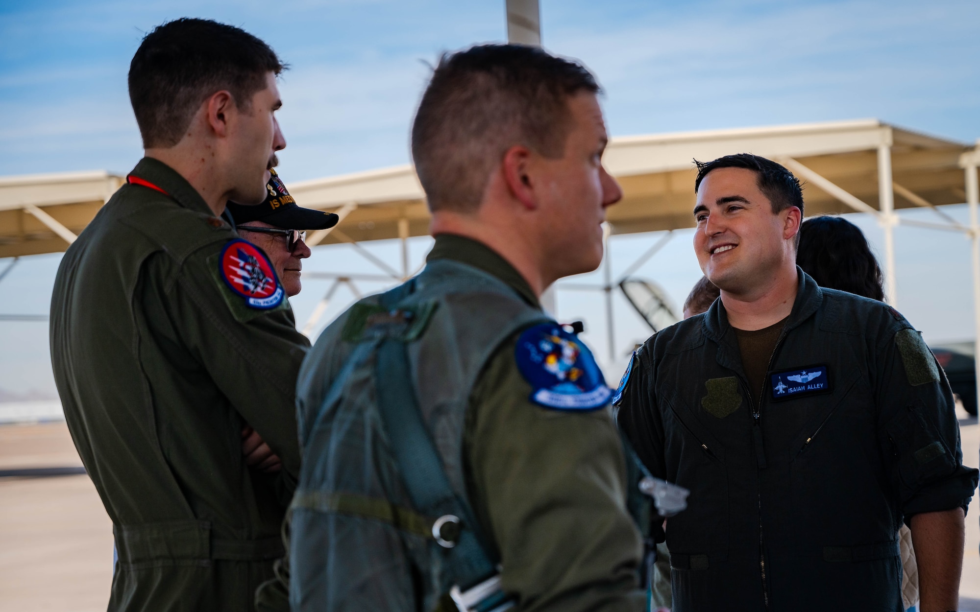 U.S. Air Force Maj. Isaiah Alley, 309th Fighter Squadron director of operations, greets fellow pilots following his final active-duty flight.