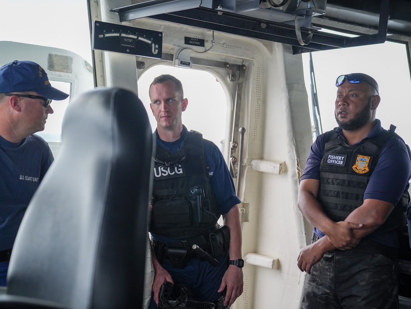 Coast Guard personnel from Coast Guard Cutter Midgett (WMSL 757) and Tuvalu representatives wait for a law enforcement brief to be held Jan. 26, 2025. The Coast Guard continues to strengthen partnerships with allies, including our partnership with Tuvalu. Through the Midgett’s operational expertise, the Coast Guard is committed to fostering cooperation, advancing professional exchange, and enhancing bilateral maritime law enforcement.  (U.S. Coast Guard photo by Petty Officer 3rd Class Jennifer Nilson)