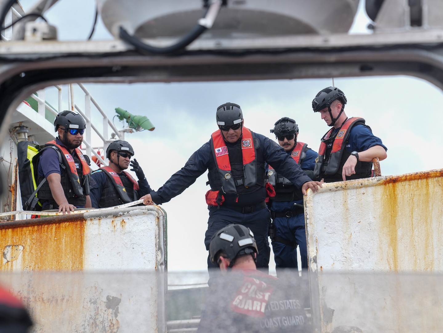 A Coast Guard 26-foot over-the-horizon cutter boat crew from Coast Guard Cutter Midgett (WMSL 757) prepares to onload Tuvalu ship riders during a bilateral ship rider agreement boarding Jan. 26, 2025. The Coast Guard continues to strengthen partnerships with allies, including our trusted Tuvalu partnership, to enhance maritime security and valued sovereignty in the Pacific. (U.S. Coast Guard photo by Petty Officer 3rd Class Jennifer Nilson)