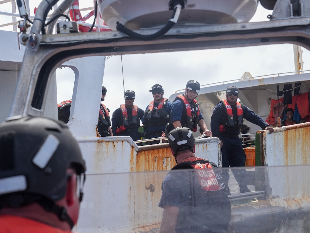 A 26-foot over-the-horizon cutter boat crew from Coast Guard Cutter Midgett (WMSL 757) approaches a fishing vessel Jan. 26, 2025. The collaboration between the Coast Guard and Tuvalu contributes to regional stability, helps maintain an enduring presence and builds regional resilience against malign threats. (U.S. Coast Guard photo by Petty Officer 3rd Class Jennifer Nilson)