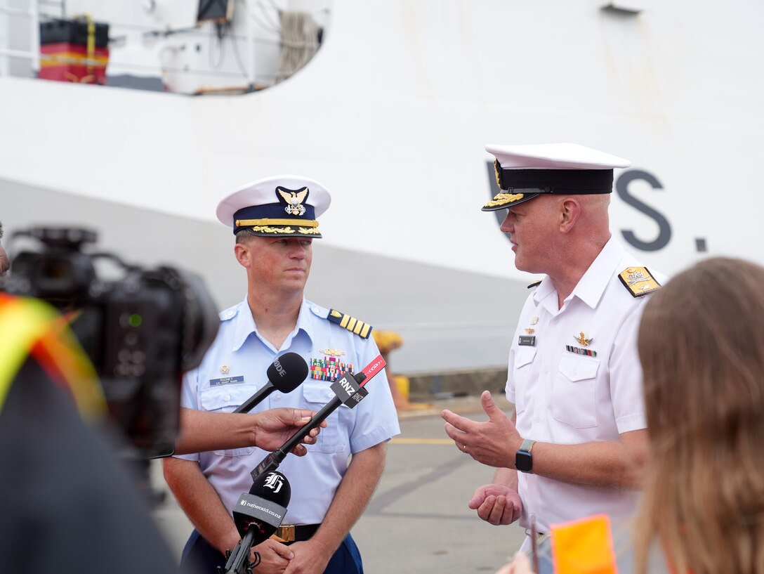 Coast Guard Capt. Matthew Rooney, the commanding officer of the Coast Guard Cutter Midgett (WMSL 757) stands beside Deputy Chief of Navy, Commodore Quentin Randall, of the Royal New Zealand Navy during a media engagement in Wellington, New Zealand Feb. 10, 2025. Midgett is deployed in Oceania to strengthen relationships with partner nations to build a stable and resilient region with unrestricted, lawful access to the maritime commons. (U.S. Coast Guard photo by Petty Officer 3rd Class Jennifer Nilson)