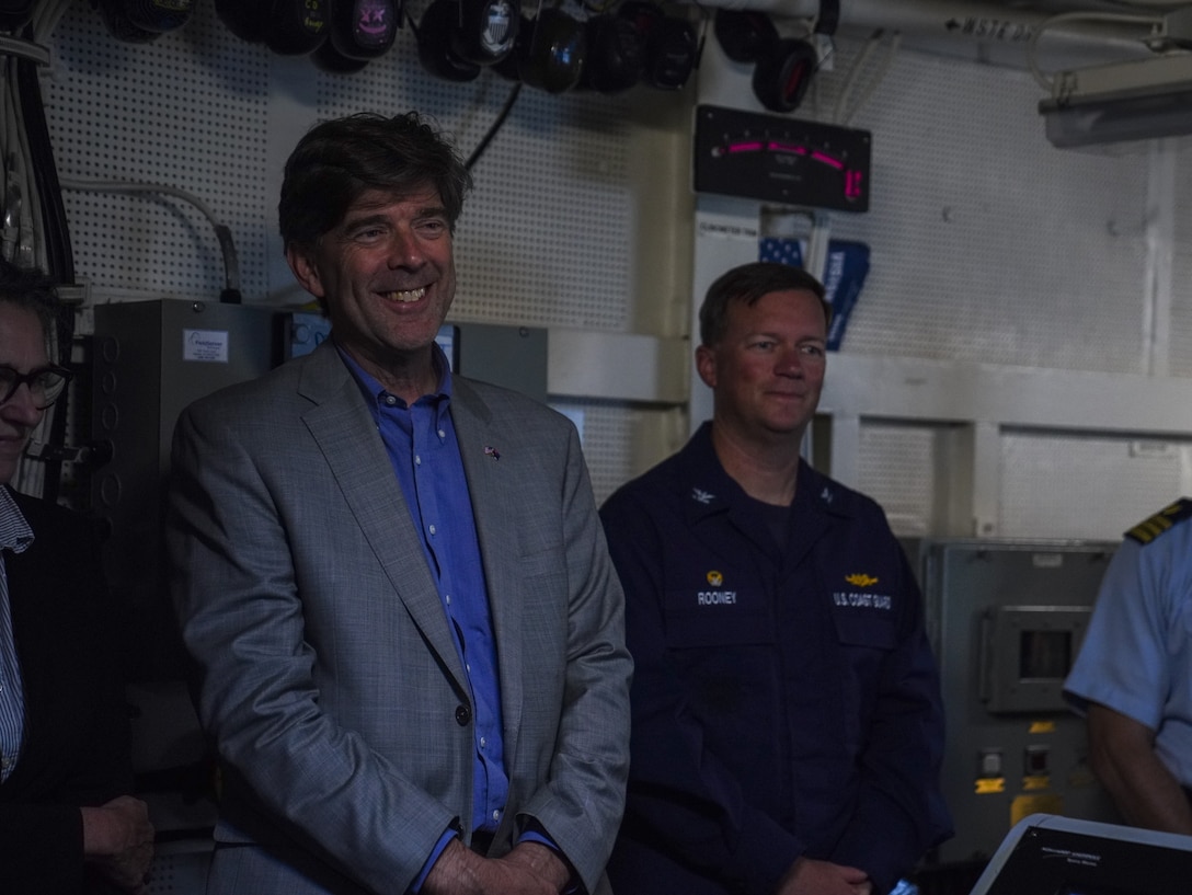 Coast Guard Capt. Matthew Rooney, the commanding officer of Coast Guard Cutter Midgett (WMSL 757) and Chargé d’ Affaires David Gehrenbeck, stand in the engineering control room of the Midgett in Wellington, New Zealand Feb. 12, 2025. The Coast Guard and New Zealand’s actively work together in peacekeeping and international security efforts around the world. (U.S. Coast Guard photo by Petty Officer 3rd Class Jennifer Nilson)