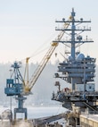 Samsung Portal Crane 62 sits by the USS Ronald Reagan (CVN 76) mooored at Pier Bravo, Jan 21, Puget Sound Naval Shipyard & Intermediate Maintenance Facility Bremerton.

(U.S Navy Photo by Wendy Hallmark)