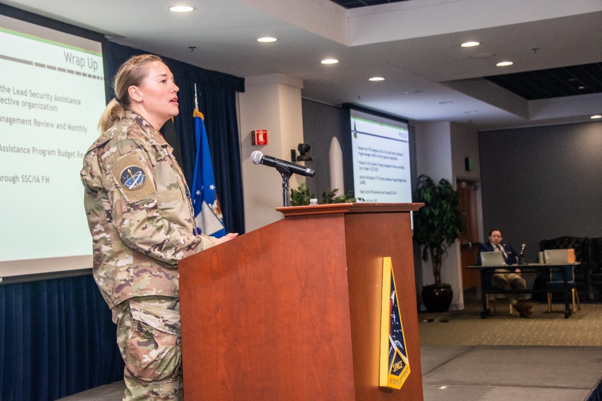 USSF Maj. Simone Zacharias, Chief of Foreign Military Sales (FMS), in collaboration with International Affairs office, speaks at the FMS conference on Feb. 12, 2025, at LAAFB, in El Segundo, Calif.  The conference was designed to prepare Space Systems Command personnel for an increase in foreign military sales to foreign allies and partners. (U.S. Space Force Photo by Van Ha)