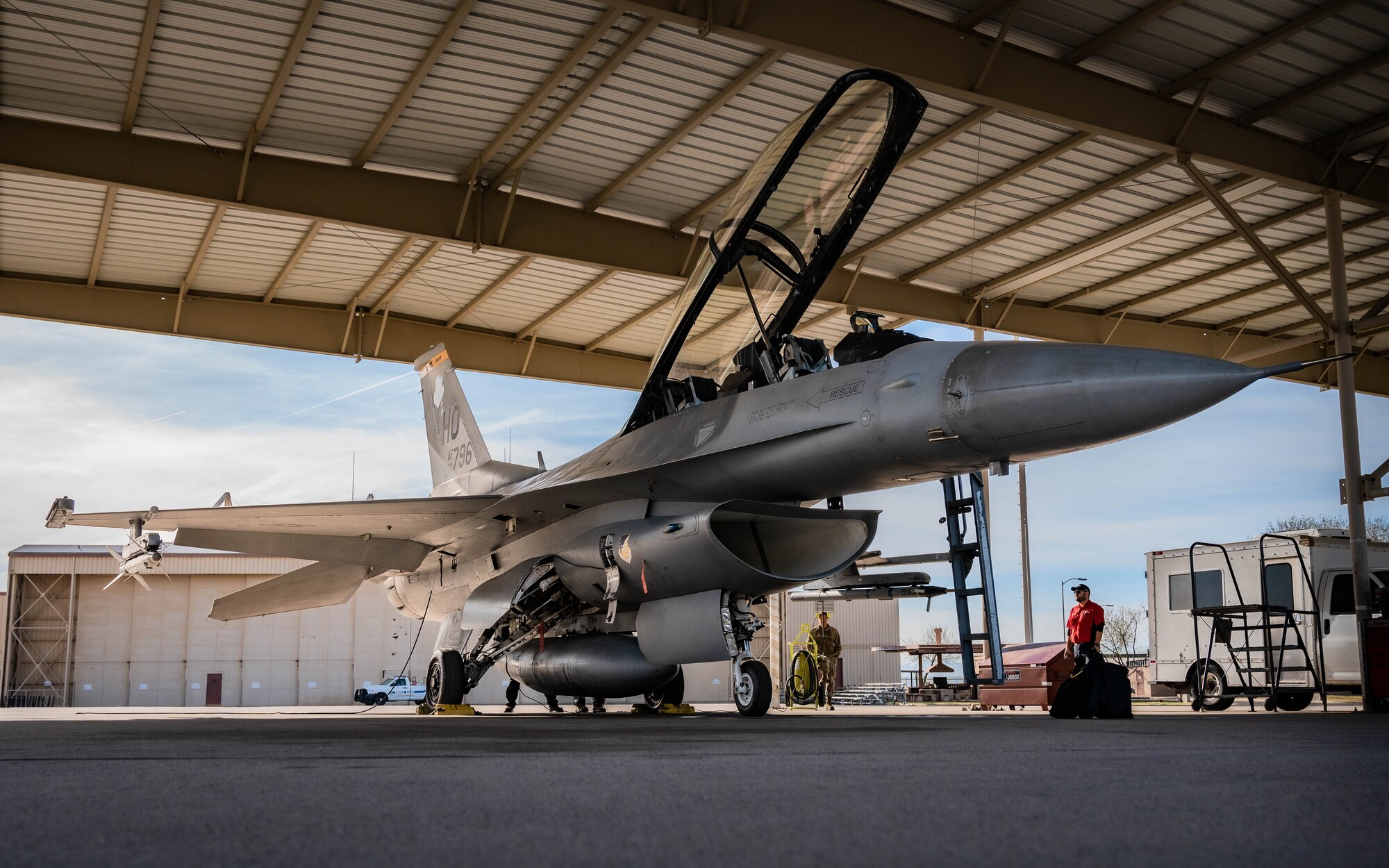 U.S. Air Force Maj. Isaiah Alley, 309th Fighter Squadron director of operations, and other Airmen assigned to the 56th Fighter Wing conduct pre-flight checks on a U.S. Air Force F-16 Fighting Falcon before take-off.