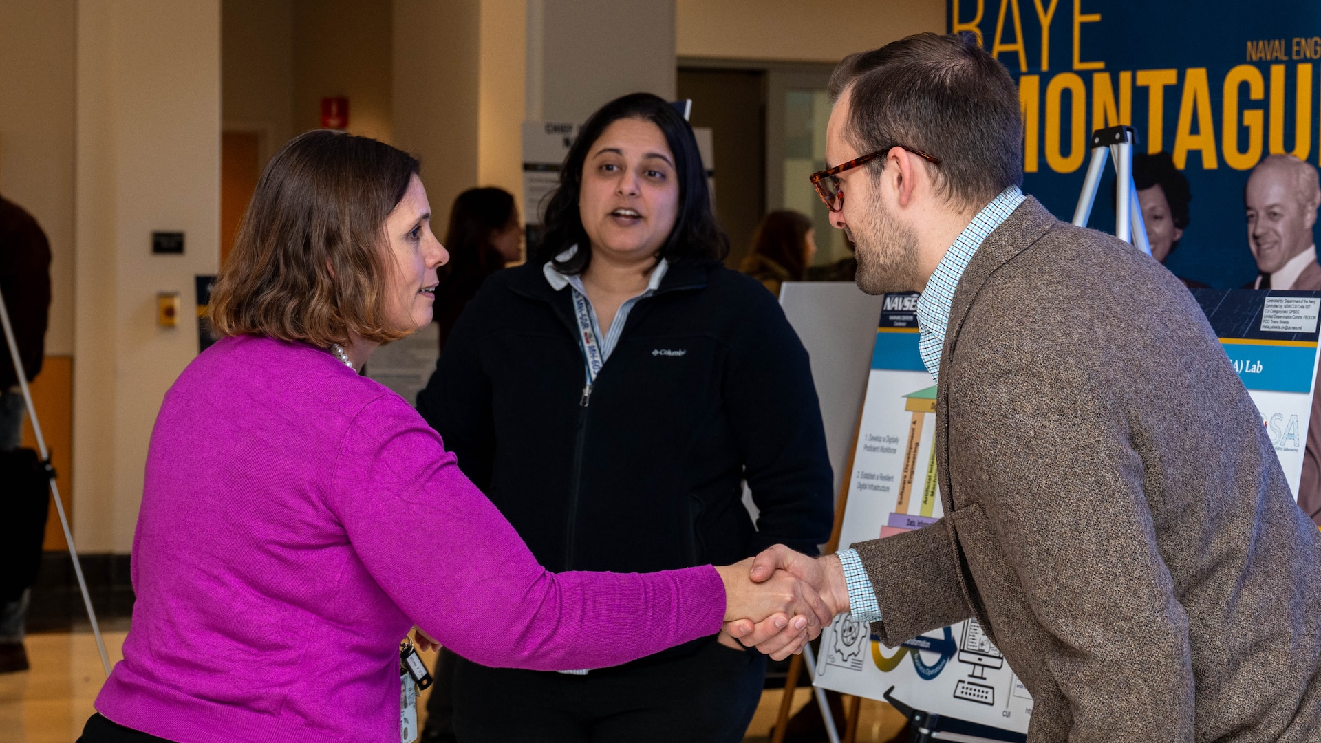 Naval Surface Warfare Center, Carderock Division's Chief Technology Officer, Dr. Elissa Trueman, meets with attendees during the poster session and open house of an enterprise-wide event themed “Design Your Future,” held at Carderock' Raye Montague Center to commemorate Engineers Week, Feb. 18, 2025.