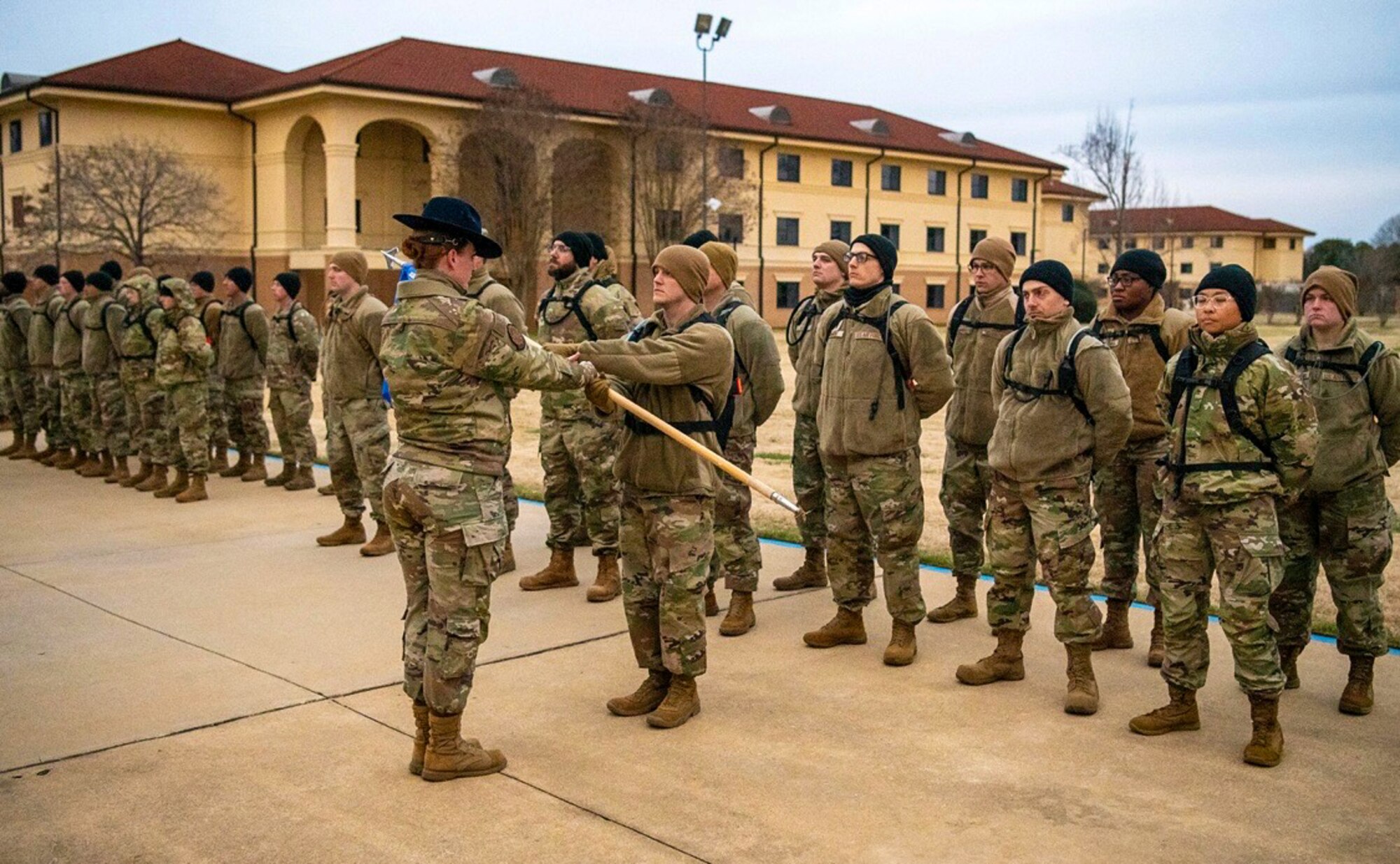 U.S. Air Force Tech. Sgt. Cally Hatrick, 22nd Training Support Squadron military training instructor, conducts a guidon exchange at Maxwell Air Force Base, Alabama, Jan. 15, 2025.