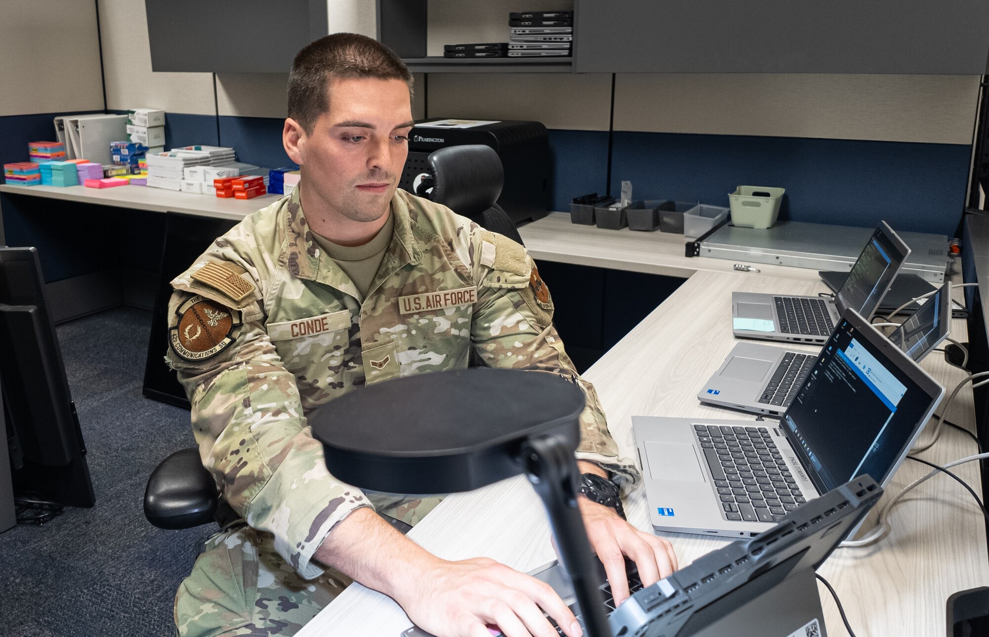 U.S. Air Force Airman 1st Class Ethan Conde, 42nd Communication Squadron client system technician works on his computer at Maxwell Air Force Base, Alabama, Feb.19, 2025.