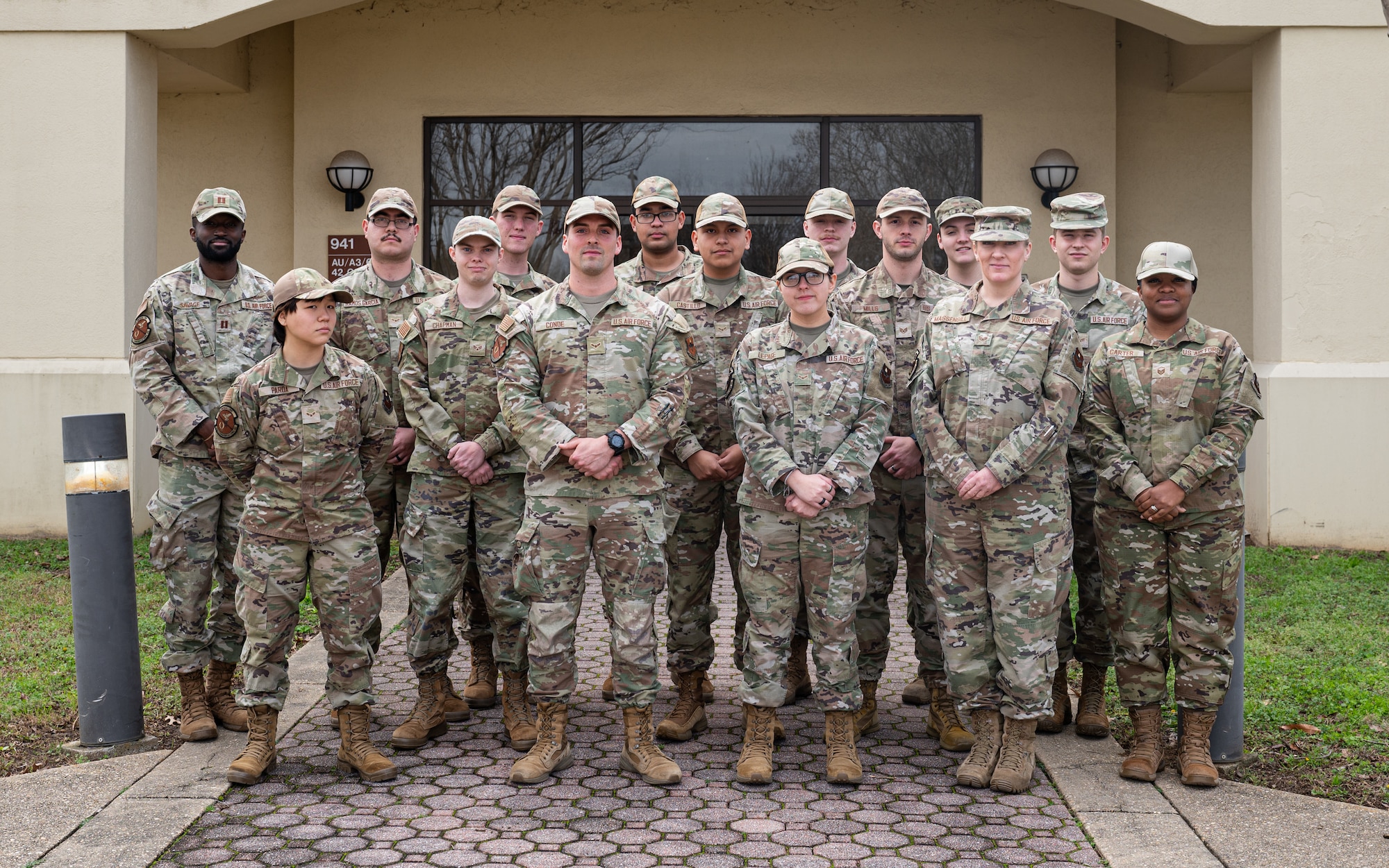 U.S. Air Force Airman 1st Class Ethan Conde, 42nd Communication Squadron client system technician pose for a group photo with his team at Maxwell Air Force Base, Alabama, Feb.19, 2025.