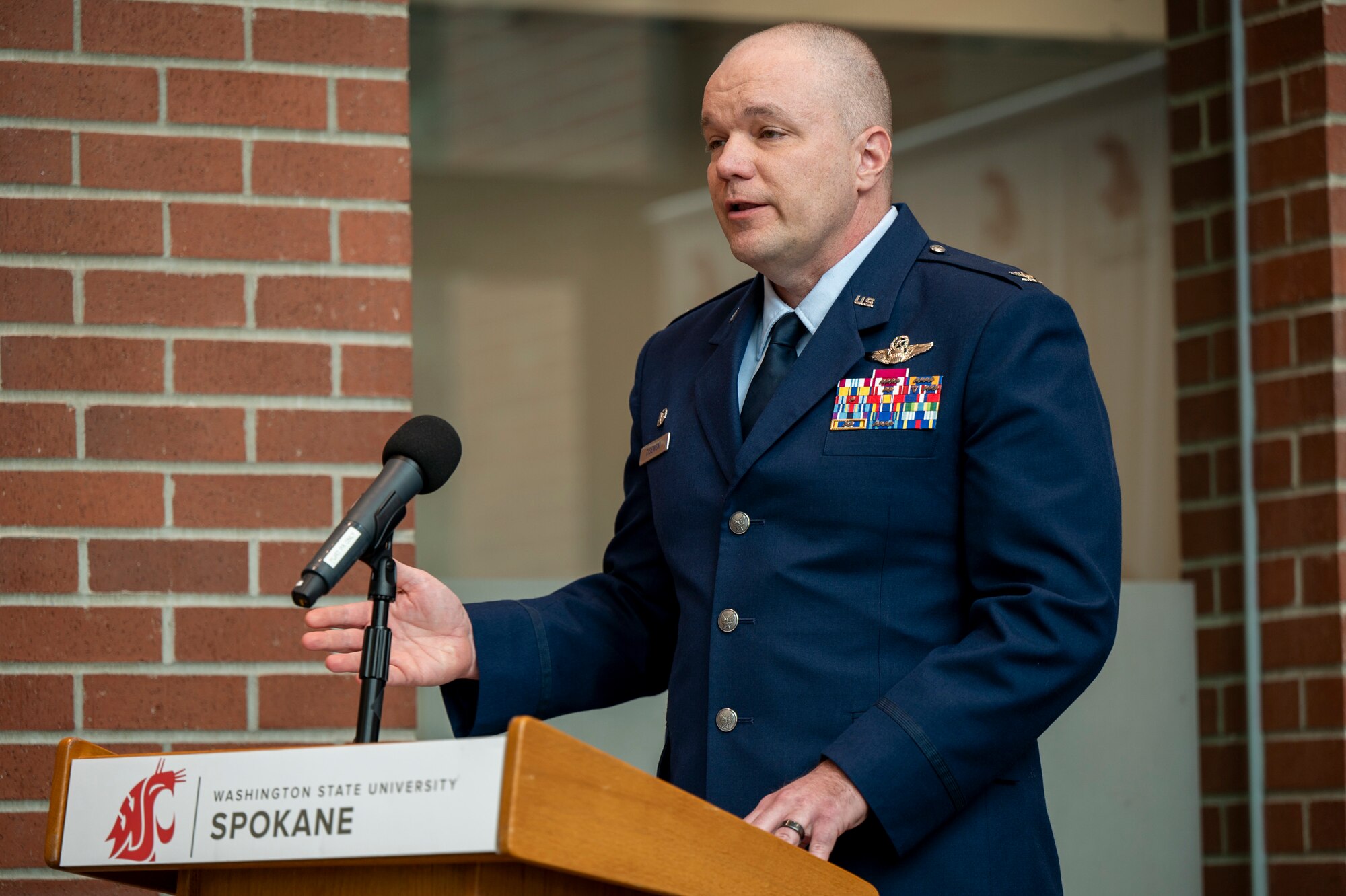 A person speaks at a podium