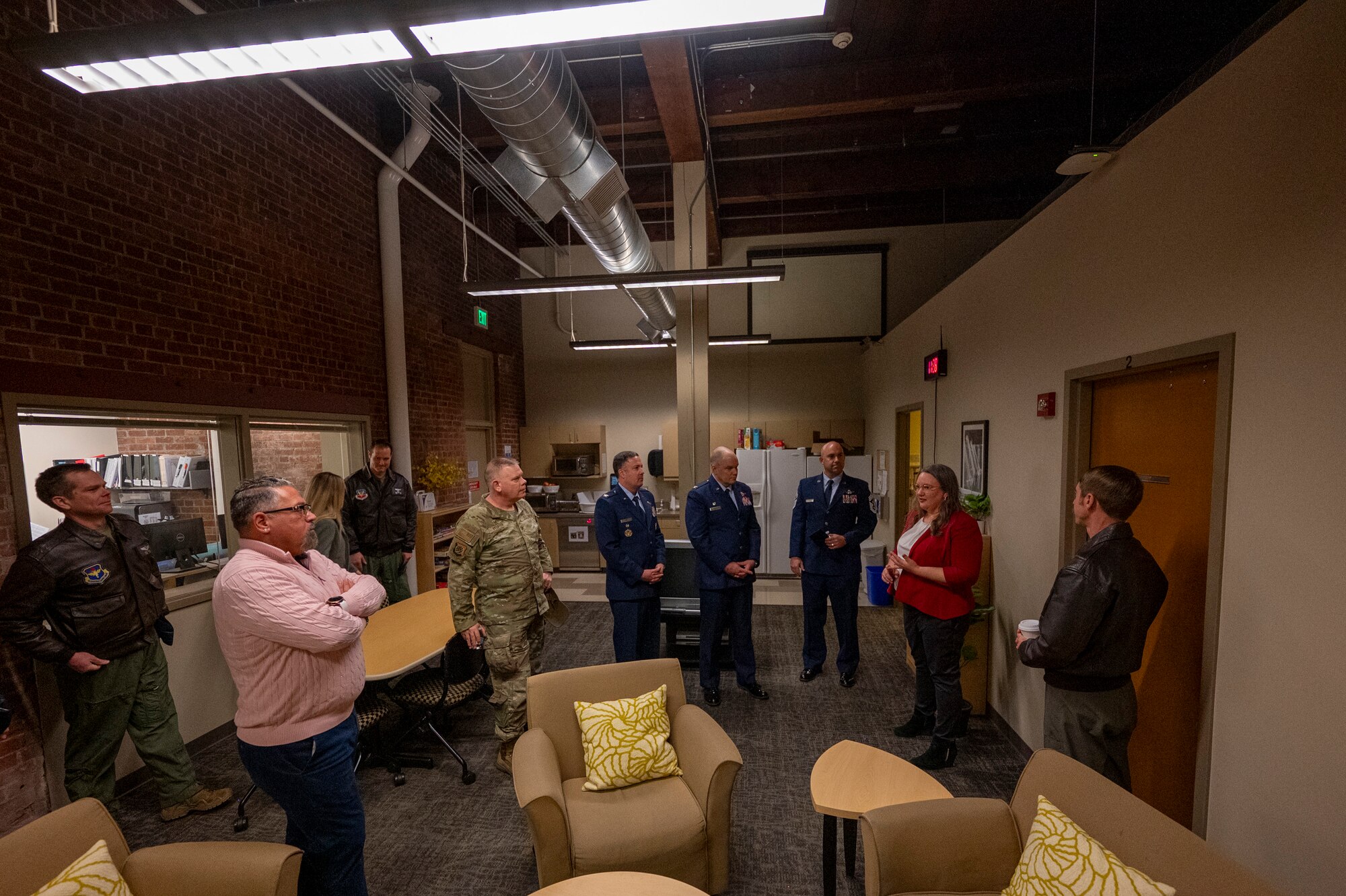Military members tour a facility