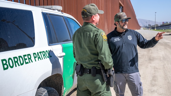 NCIS agents work alongside U.S. Customs and Border Control at the U.S.-Mexico border in San Ysidro, Calif., Feb. 19, 2025.