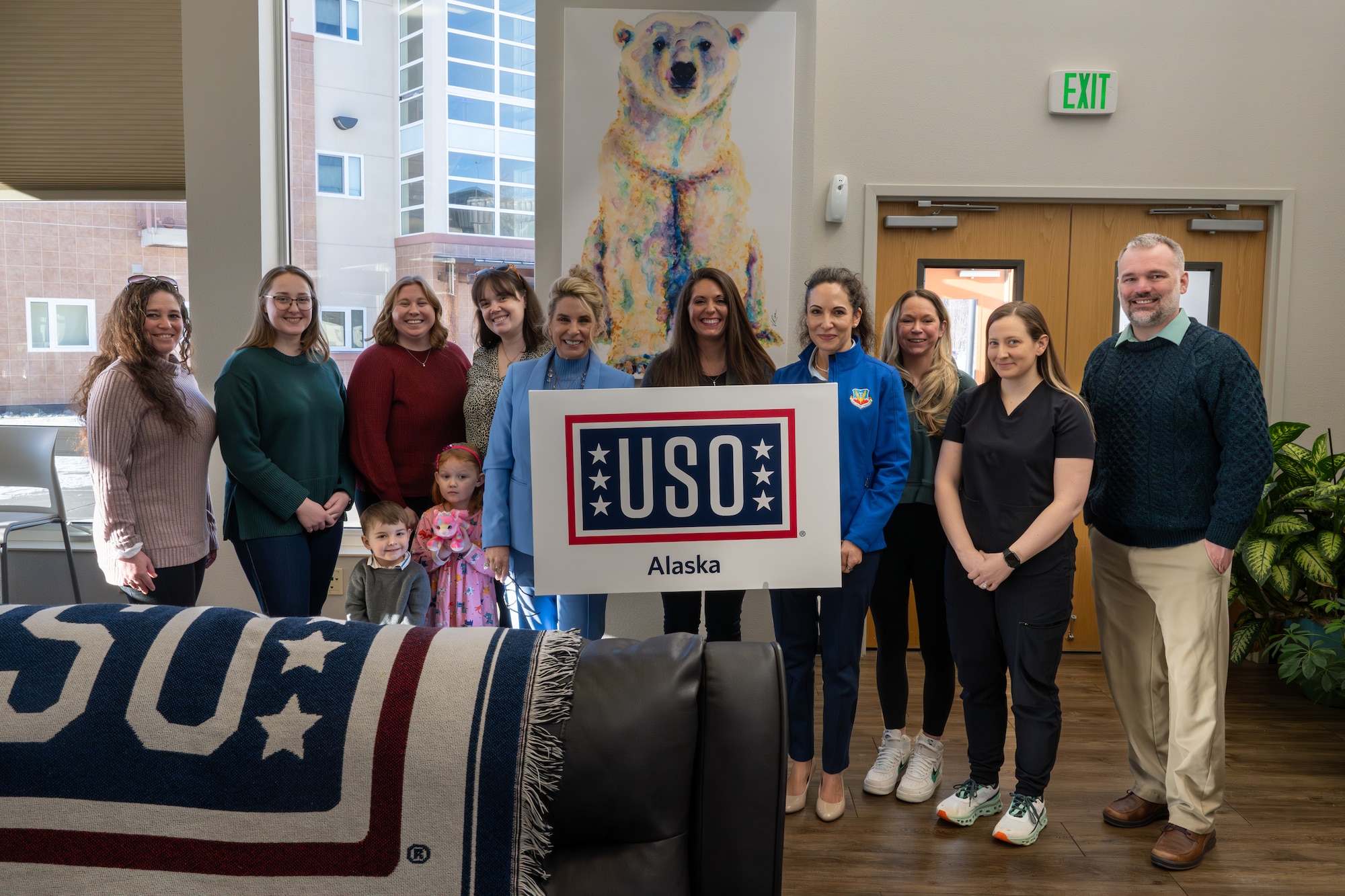 Mrs. Cindy Wilsbach (center left), wife of U.S. Air Force Gen. Ken Wilsbach, commander of Air Combat Command, and Dr. Doniel Wolfe (center right), wife of Chief Master Sgt. Dave Wolfe, ACC command chief, pose for a photo with spouses of first sergeants during a visit to Elmendorf Air Force Base, Alaska, Feb. 13. The visit provided an opportunity for them to learn about the various programs and resources available to ACC service members and families, promoting resilience and connection among military families and the JBER community.