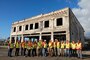 The Recovery Field Office staff near the Lahaina Store on Front Street marking the completion of debris removal from commercial properties