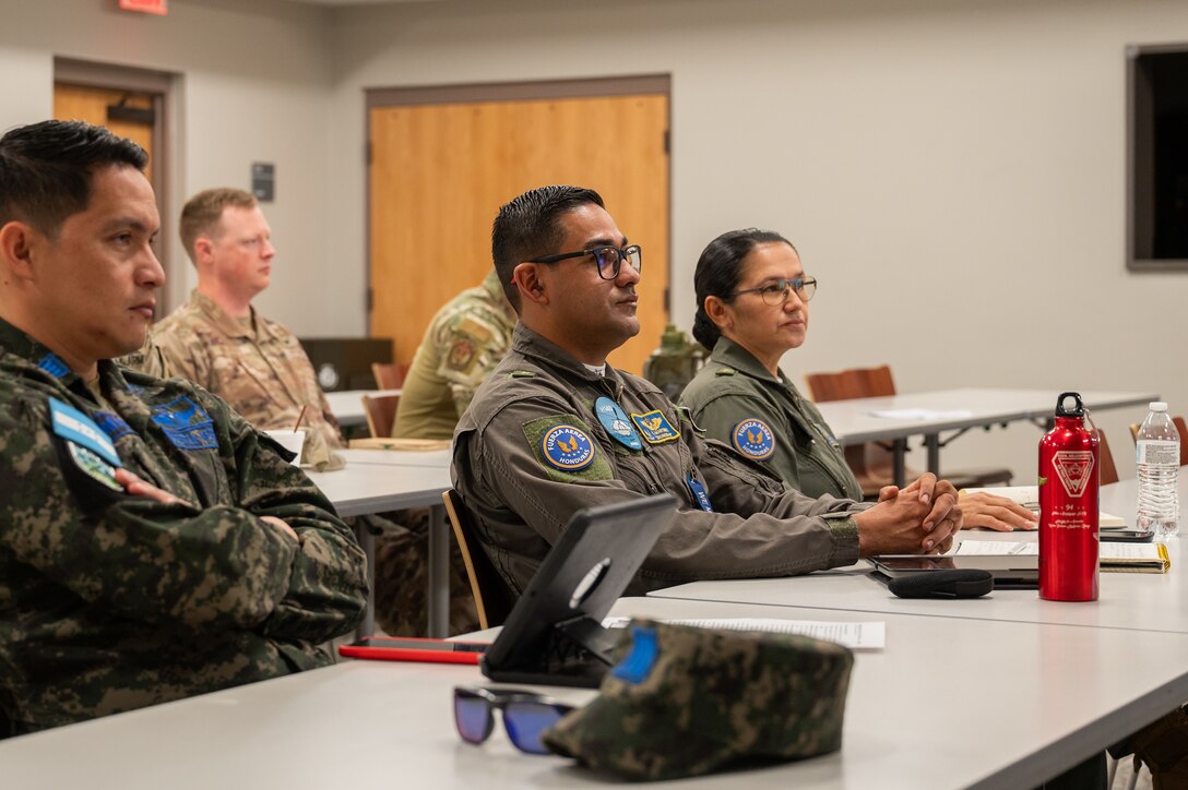 Joint Task Force-Bravo and Honduras air force members attend academic training on a collapsible water-carrying device during a tabletop exercise at Soto Cano Air Base, Honduras, February 19, 2025.