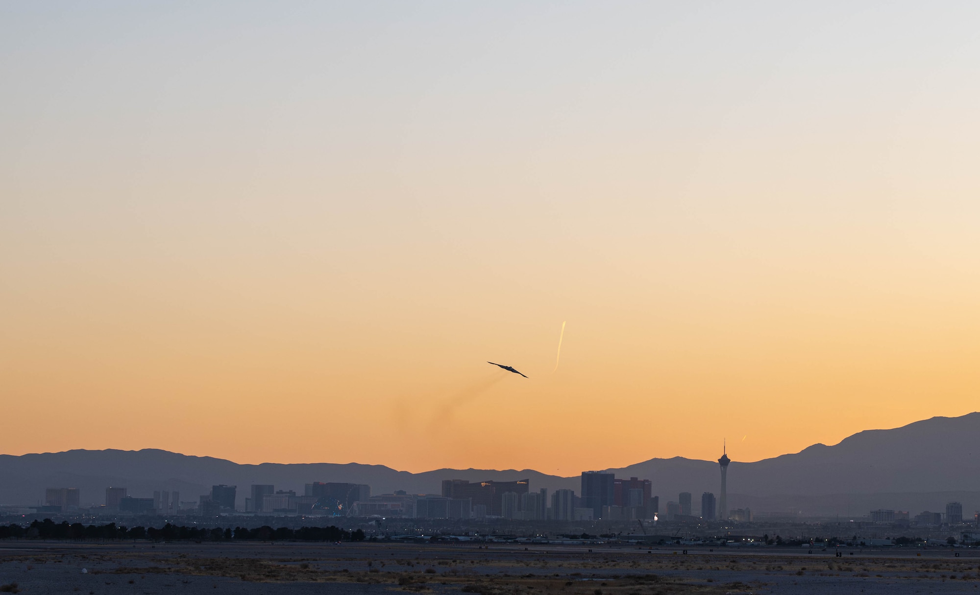 A B-2 Spirit stealth bomber gains altitude after takeoff during Exercise Bamboo Eagle at Nellis Air Force Base, Nevada, Feb. 10, 2025. The exercise demonstrates the Air Force’s ability to project power and deter potential adversaries across the globe. (U.S. Air Force photo by Senior Airman Bryson Sherard)