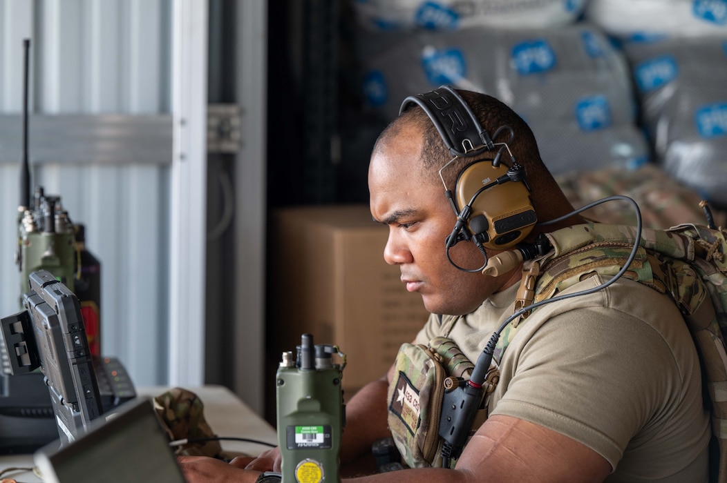 Photo of Airman reviewing flight information