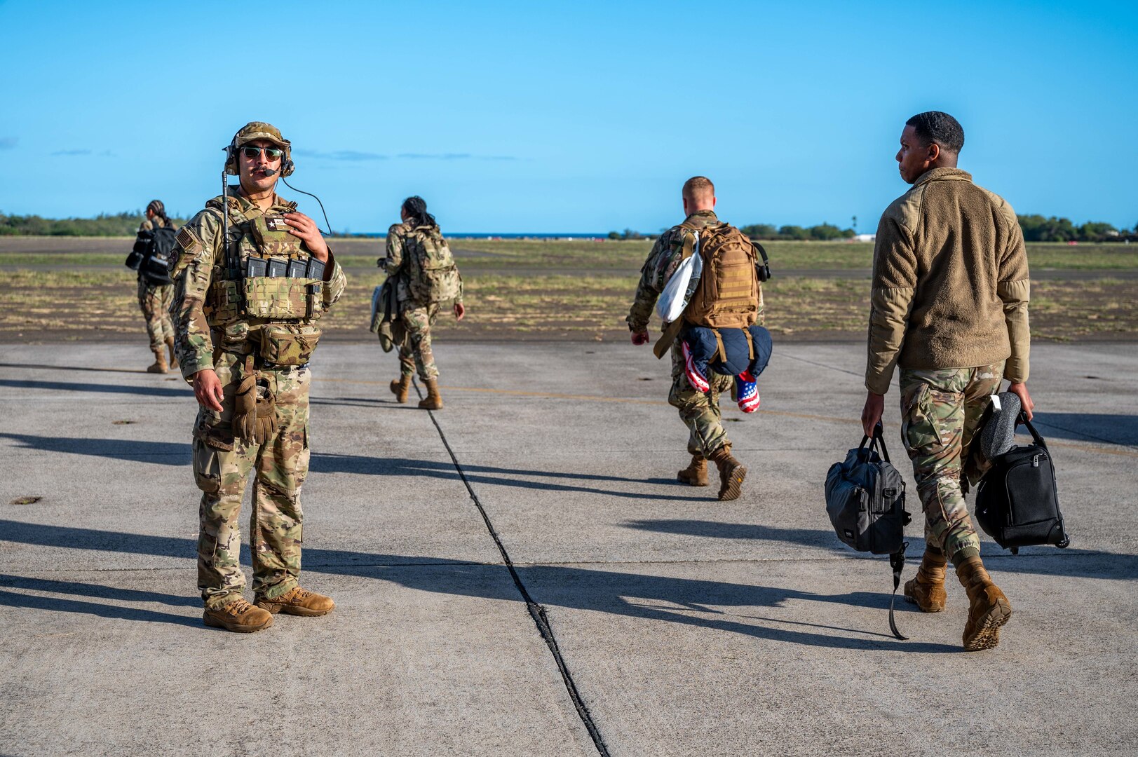Photo of Airman directing personnel