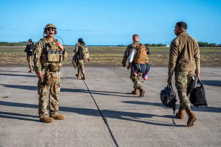Photo of Airman directing personnel