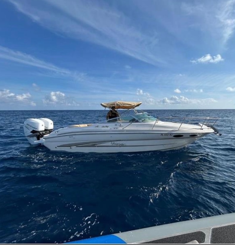 A Customs and Border Protection Air and Marine Operations boat crew alongside one of two recreational vessels involved in a suspected smuggling venture in U.S. territorial waters, Feb. 18, 2025. One suspected smuggler was transferred to Homeland Security Investigations and the remaining 23 aliens onboard were returned to The Bahamas. (Courtesy photo)