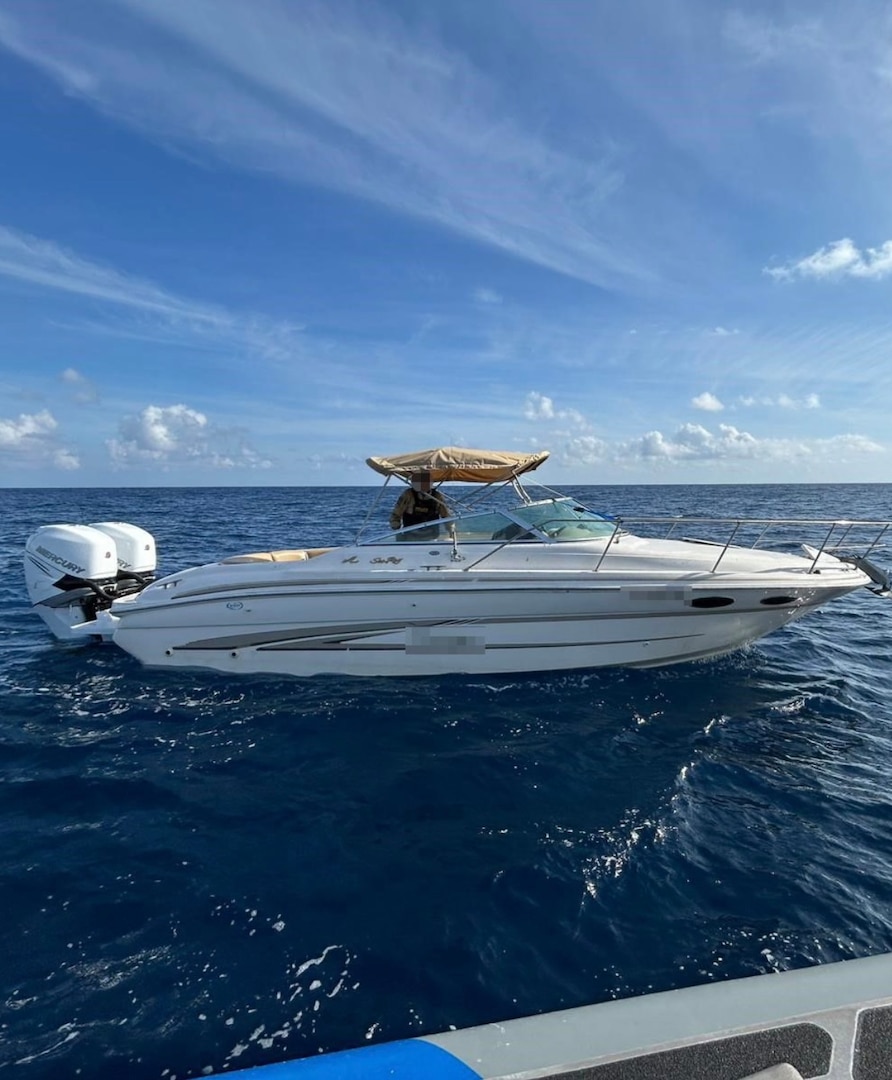 A Customs and Border Protection Air and Marine Operations boat crew alongside one of two recreational vessels involved in a suspected smuggling venture in U.S. territorial waters, Feb. 18, 2025. One suspected smuggler was transferred to Homeland Security Investigations and the remaining 23 aliens onboard were returned to The Bahamas. (Courtesy photo)